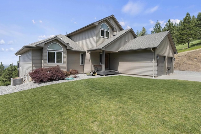 17607 E Judkins Rd, Spokane, WA 99217 - view of front of home with a garage, roof with shingles, a front yard, and driveway