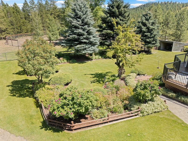 996A Basin Rd, Colville, WA 99114 - view of yard with a wooden deck, an outbuilding, and a wooded view