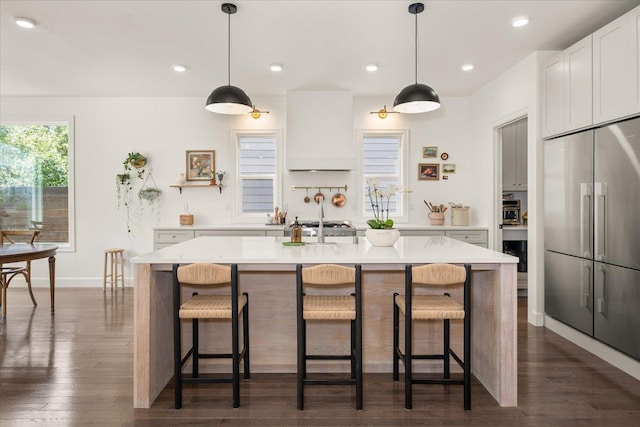 3103 W 18th Ave, Spokane, WA 99224 - kitchen featuring stainless steel built in refrigerator, custom range hood, light countertops, dark wood-style floors, and recessed lighting