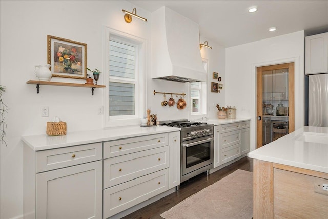 3103 W 18th Ave, Spokane, WA 99224 - kitchen featuring high end range, premium range hood, dark wood-type flooring, light countertops, and recessed lighting