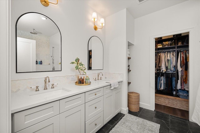 3103 W 18th Ave, Spokane, WA 99224 - full bathroom with double vanity, a spacious closet, and decorative backsplash