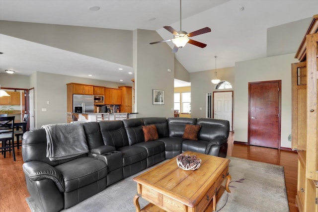 2716 S Man O War Ln, Veradale, WA 99037 - living room featuring high vaulted ceiling, a ceiling fan, and light wood finished floors