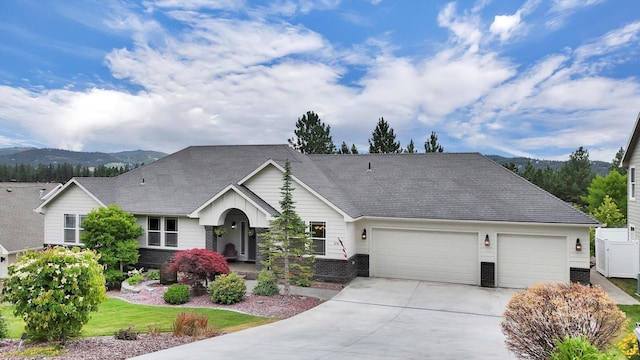 2716 S Man O War Ln, Veradale, WA 99037 - view of front of property featuring an attached garage, driveway, and a mountain view