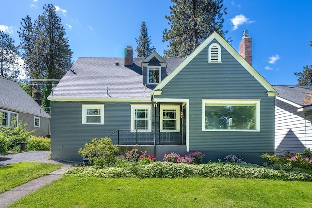 1123 W 25th Ave, Spokane, WA 99203 - rear view of property with a chimney and a lawn
