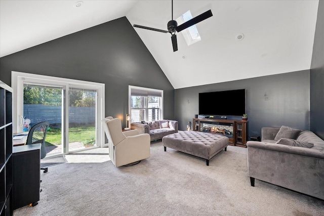 1123 W 25th Ave, Spokane, WA 99203 - living area featuring high vaulted ceiling, a skylight, a ceiling fan, and carpet floors