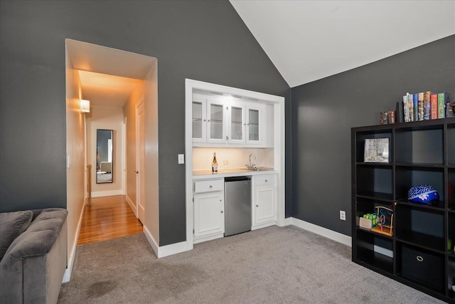 1123 W 25th Ave, Spokane, WA 99203 - indoor wet bar featuring fridge, lofted ceiling, and light carpet
