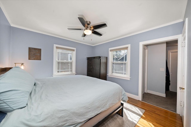 1123 W 25th Ave, Spokane, WA 99203 - bedroom with multiple windows, wood finished floors, crown molding, and ceiling fan