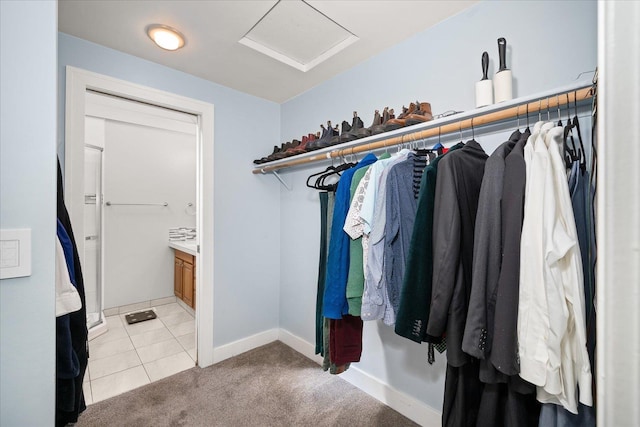 1123 W 25th Ave, Spokane, WA 99203 - spacious closet with attic access, light tile patterned floors, and light carpet