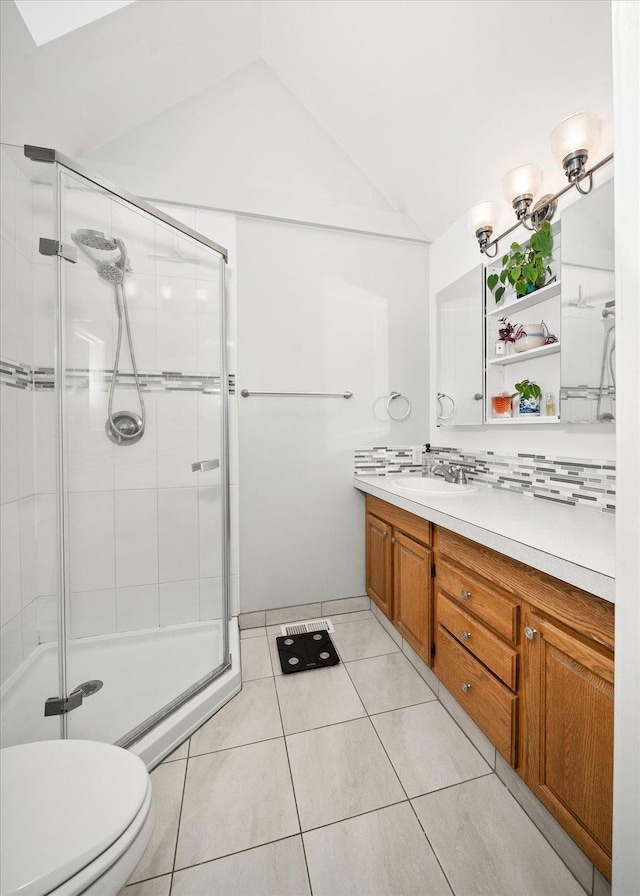 1123 W 25th Ave, Spokane, WA 99203 - bathroom with vanity, a shower stall, lofted ceiling, and tile patterned flooring