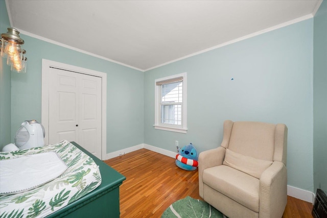 1123 W 25th Ave, Spokane, WA 99203 - bedroom with crown molding, wood finished floors, and a closet
