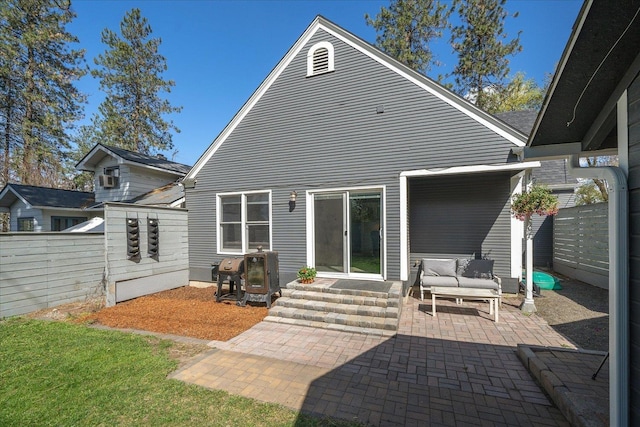 1123 W 25th Ave, Spokane, WA 99203 - back of property with a fenced backyard, a patio, outdoor lounge area, and entry steps