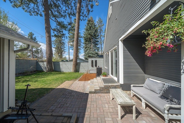 1123 W 25th Ave, Spokane, WA 99203 - fenced backyard with a patio and outdoor lounge area