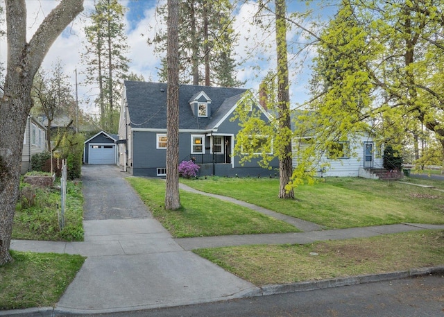 1123 W 25th Ave, Spokane, WA 99203 - view of front of home with driveway, a front lawn, a garage, and an outdoor structure