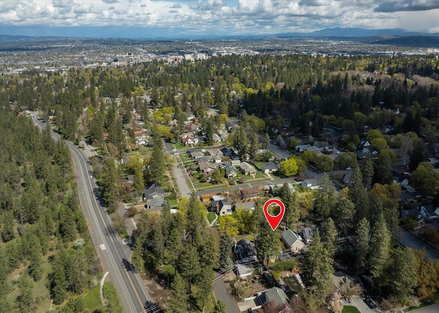 1123 W 25th Ave, Spokane, WA 99203 - aerial view of property and surrounding area with a heavily wooded area