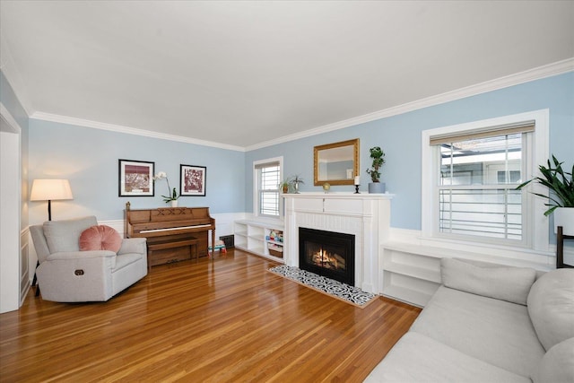 1123 W 25th Ave, Spokane, WA 99203 - living room with ornamental molding, light wood finished floors, a fireplace with flush hearth, and wainscoting