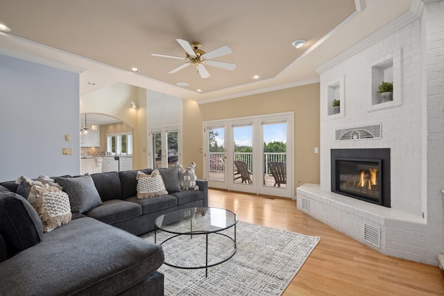 1714 E S Ridge Dr, Spokane, WA 99223 - living room with light wood-style flooring, a fireplace, ceiling fan, recessed lighting, and crown molding