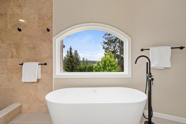 1714 E S Ridge Dr, Spokane, WA 99223 - bathroom featuring a freestanding bath, plenty of natural light, and tile patterned flooring