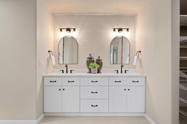 1714 E S Ridge Dr, Spokane, WA 99223 - bathroom featuring double vanity, tile patterned flooring, and a walk in closet