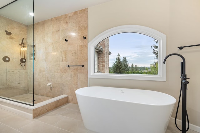 1714 E S Ridge Dr, Spokane, WA 99223 - bathroom with a freestanding bath, a tile shower, and tile patterned flooring
