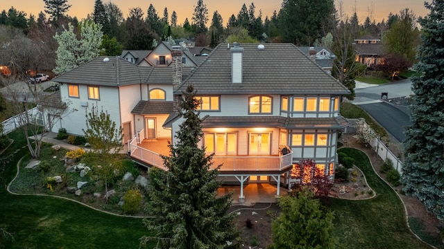 1714 E S Ridge Dr, Spokane, WA 99223 - back of property at dusk featuring view of scattered trees, a carport, and a tiled roof