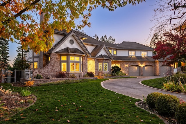 1714 E S Ridge Dr, Spokane, WA 99223 - view of front of home featuring driveway, brick siding, and stone siding