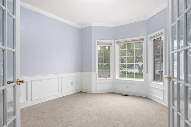 1714 E S Ridge Dr, Spokane, WA 99223 - unfurnished room with french doors, a decorative wall, crown molding, carpet, and wainscoting