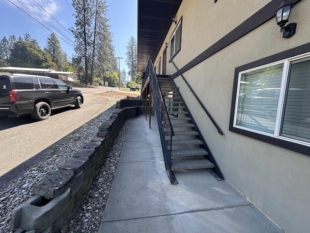360 E 7th Ave # B, Colville, WA 99114 - view of property exterior featuring stucco siding and stairway