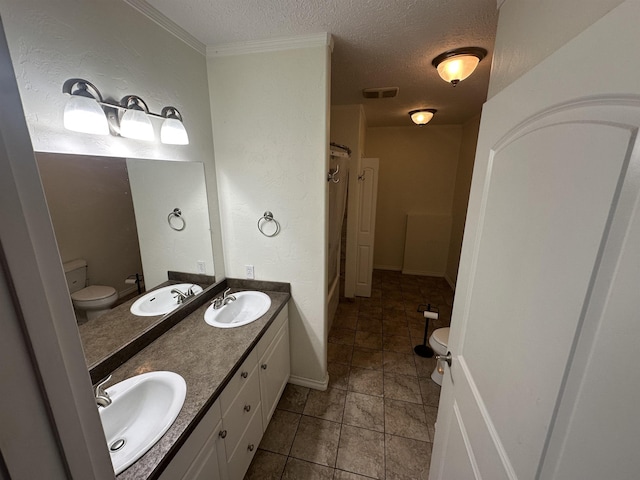 360 E 7th Ave # B, Colville, WA 99114 - full bath featuring a textured ceiling, double vanity, tile patterned floors, and crown molding