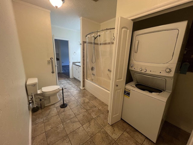360 E 7th Ave # B, Colville, WA 99114 - bathroom featuring stacked washer / dryer, shower / bath combo with shower curtain, and a textured ceiling