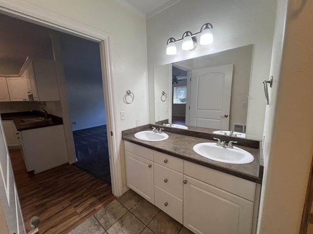 360 E 7th Ave # B, Colville, WA 99114 - full bath with double vanity, wood finished floors, and crown molding