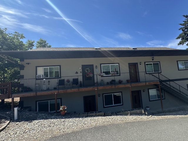 360 E 7th Ave # B, Colville, WA 99114 - view of front of property featuring stairway and stucco siding
