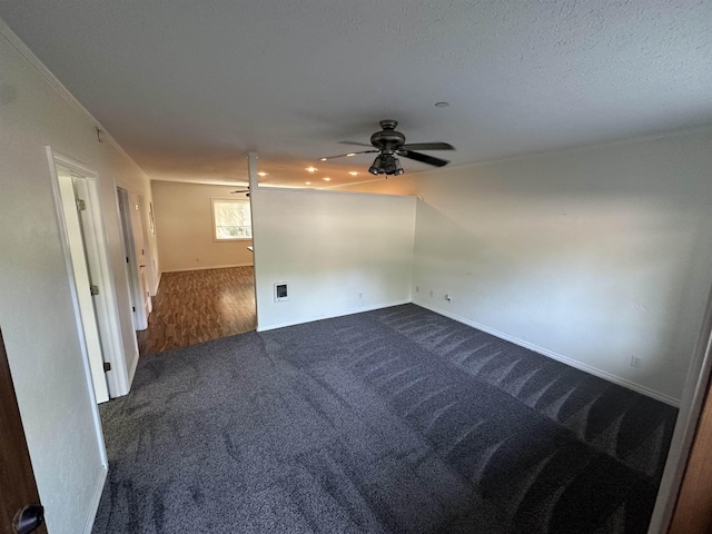 360 E 7th Ave # B, Colville, WA 99114 - empty room featuring dark colored carpet and a ceiling fan