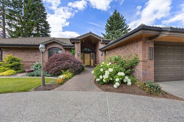 5430 S Quail Ridge Cir, Spokane, WA 99223 - single story home with brick siding, a tiled roof, and an attached garage