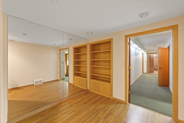 5430 S Quail Ridge Cir, Spokane, WA 99223 - spare room featuring built in features and wood finished floors
