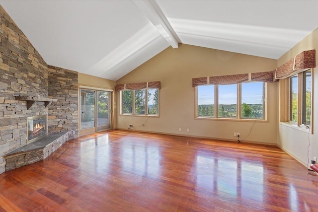 5430 S Quail Ridge Cir, Spokane, WA 99223 - unfurnished living room with wood finished floors, beam ceiling, a fireplace, and high vaulted ceiling
