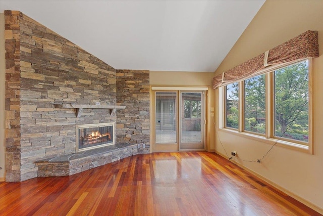 5430 S Quail Ridge Cir, Spokane, WA 99223 - unfurnished living room featuring vaulted ceiling, hardwood / wood-style floors, and a fireplace