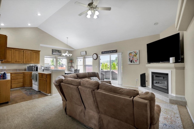 15418 E 24th Ave, Spokane Valley, WA 99037 - living room with ceiling fan, high vaulted ceiling, a tile fireplace, a chandelier, and recessed lighting