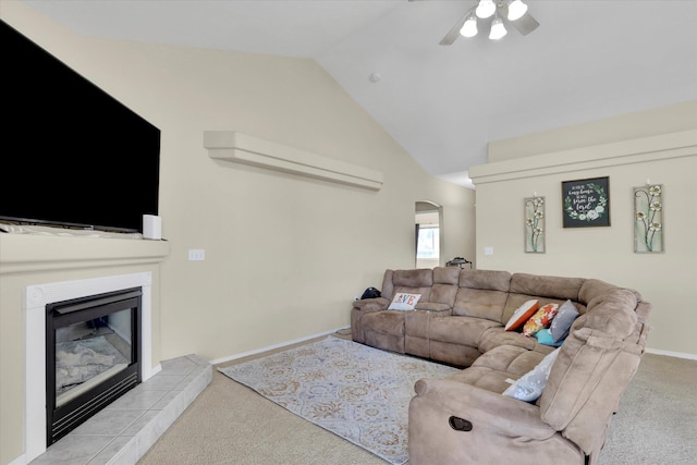 15418 E 24th Ave, Spokane Valley, WA 99037 - living area featuring carpet flooring, arched walkways, ceiling fan, a tiled fireplace, and lofted ceiling