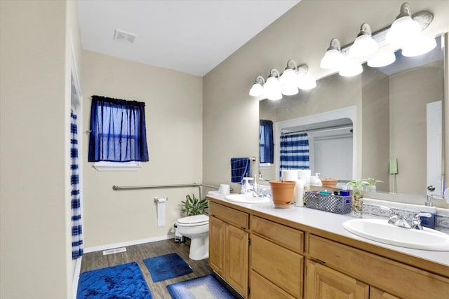 15418 E 24th Ave, Spokane Valley, WA 99037 - full bathroom featuring wood finished floors and double vanity