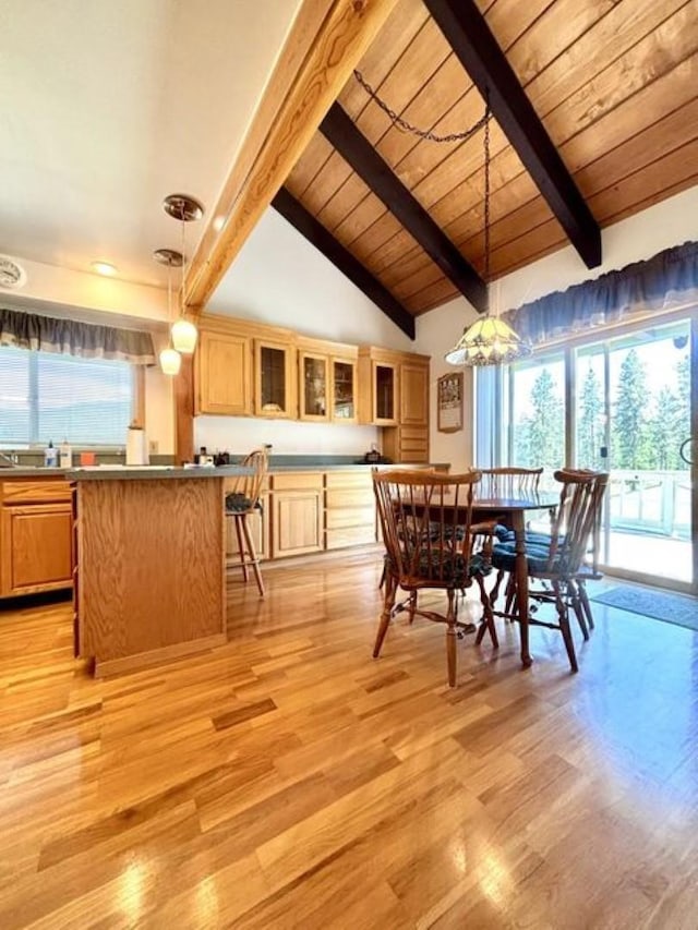1425 N Chapin Rd, Evans, WA 99126 - dining area with light wood finished floors, a chandelier, a wood ceiling with exposed beams, and high vaulted ceiling