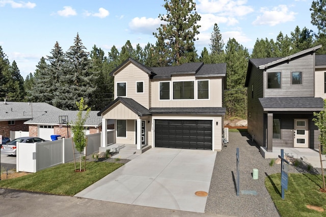 1215 S Radio Ln, Spokane Valley, WA 99212 - contemporary home featuring an attached garage, driveway, and board and batten siding