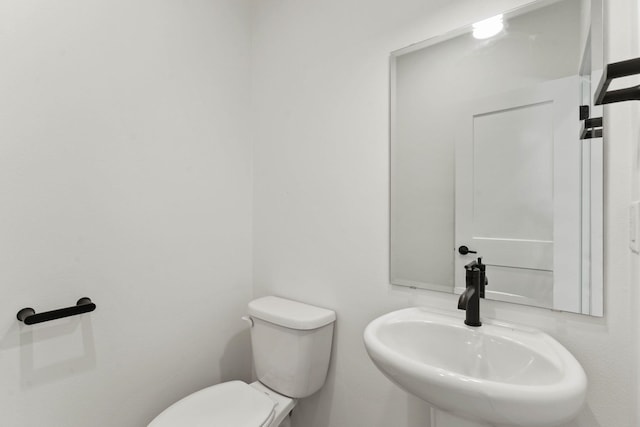 1215 S Radio Ln, Spokane Valley, WA 99212 - half bathroom featuring a sink and toilet