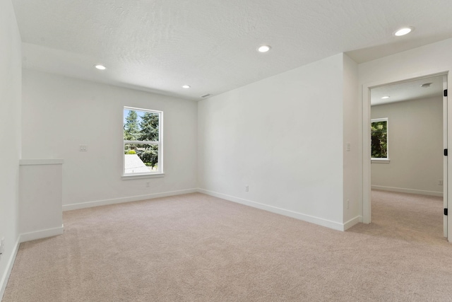 1215 S Radio Ln, Spokane Valley, WA 99212 - unfurnished room featuring light carpet, recessed lighting, and healthy amount of natural light