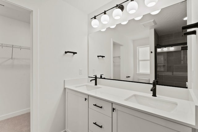 1215 S Radio Ln, Spokane Valley, WA 99212 - full bath featuring double vanity, a walk in closet, and tiled shower