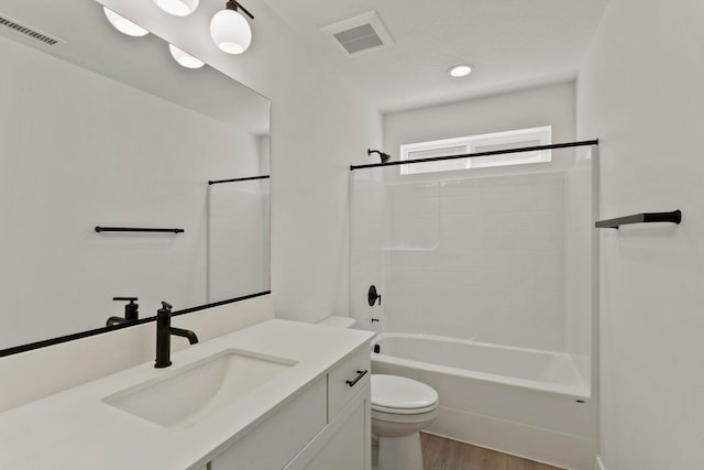 1215 S Radio Ln, Spokane Valley, WA 99212 - bathroom with vanity, wood finished floors, and bathtub / shower combination