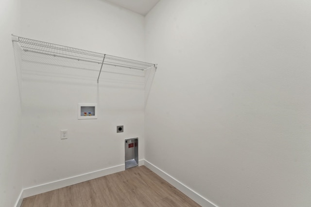 1215 S Radio Ln, Spokane Valley, WA 99212 - laundry area featuring hookup for an electric dryer, light wood-style floors, and hookup for a washing machine