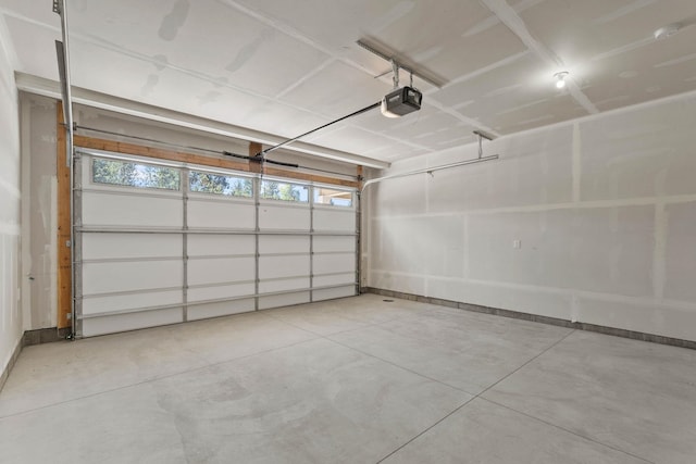 1215 S Radio Ln, Spokane Valley, WA 99212 - garage featuring a garage door opener and baseboards
