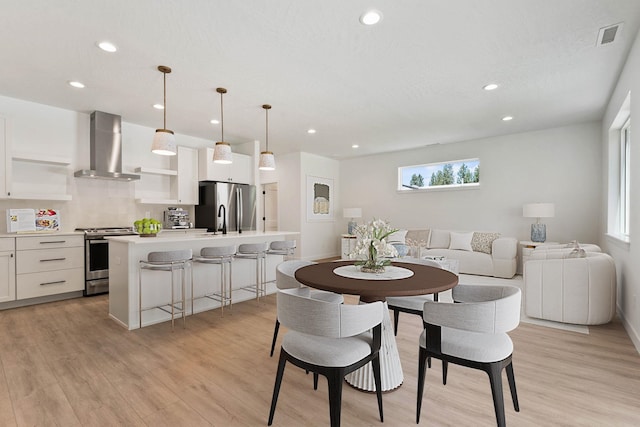 1215 S Radio Ln, Spokane Valley, WA 99212 - dining space featuring healthy amount of natural light, recessed lighting, and light wood-style floors