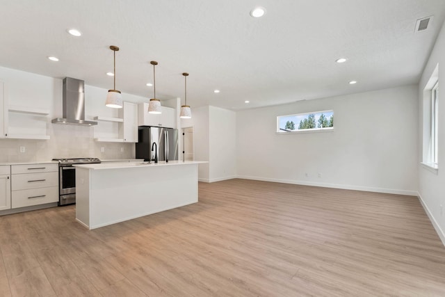 1215 S Radio Ln, Spokane Valley, WA 99212 - kitchen with appliances with stainless steel finishes, wall chimney exhaust hood, open shelves, recessed lighting, and decorative backsplash