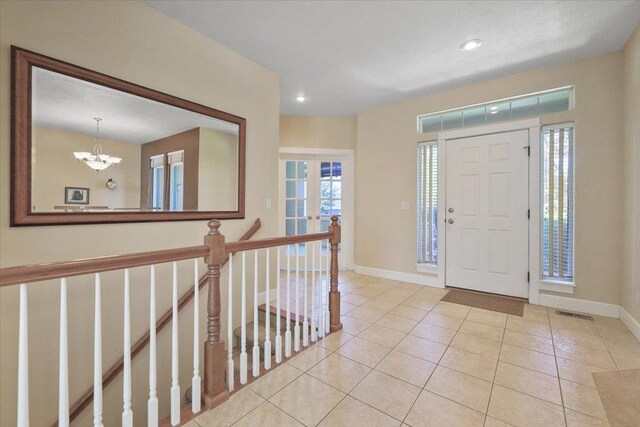 3405 W Kens Ct, Spokane, WA 99208 - entryway with tile patterned floors, a chandelier, and recessed lighting